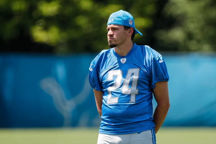 Detroit Lions place kicker John Parker Romo (24) watches practice during OTAs at Detroit Lions headquarters in Allen Park on Thursday, June 1, 2023.